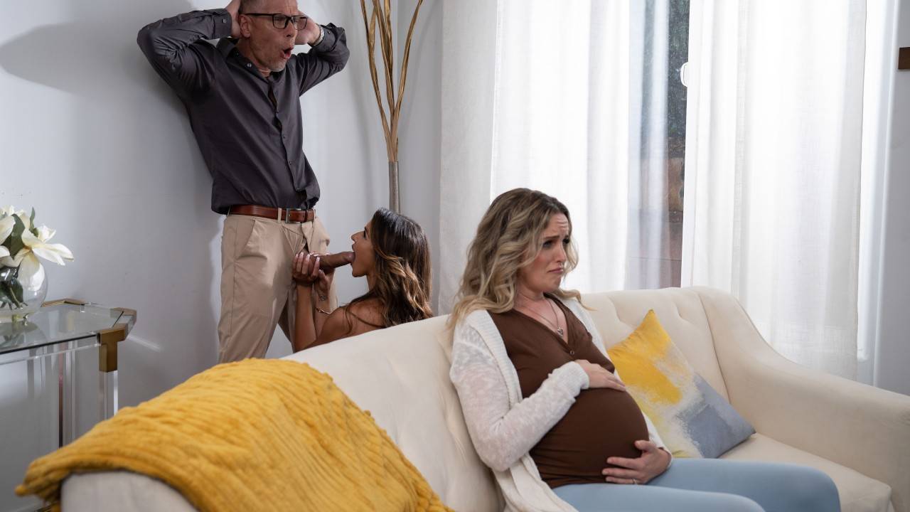 Pregnant woman on sofa with brunette and tense man