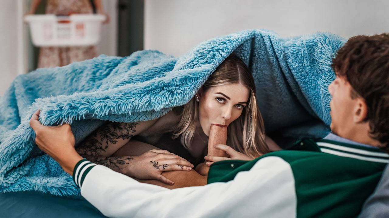 Blonde oral under blue blanket