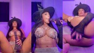 Marina Maya in witch hat, rhinestone lingerie, with toy